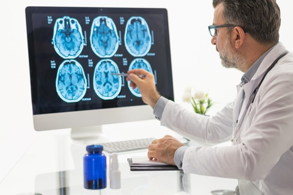 Doctor with brain scans